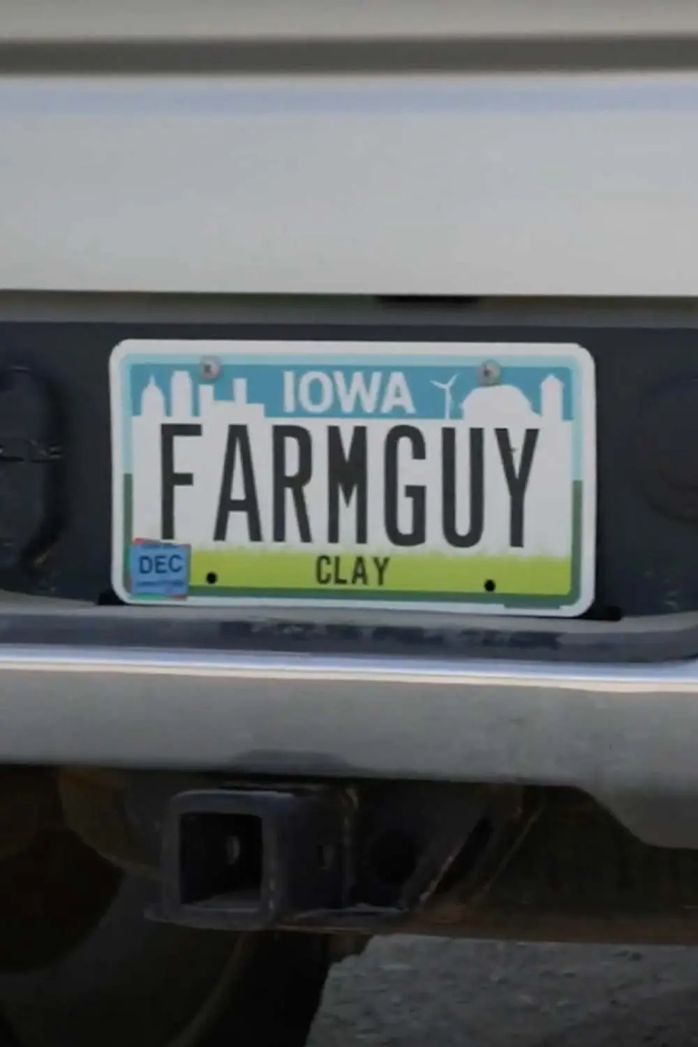 farmguy-license-plate An Iowa Clay County vanity license plate reading "FARMGUY" on an Acre Company team member's truck